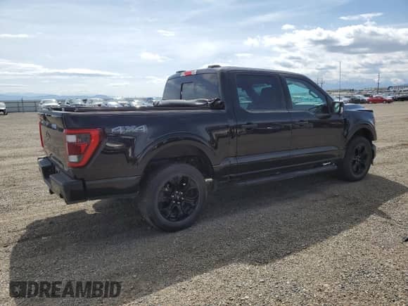 2023 Ford F-150 Lariat with VIN 1FTFW1E80PFA85216, listed as a Copart auction lot 57410065 with 20,853 mi miles and Salvage title. Bid and sale history available at DreamBid. Image 3.