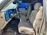 2002 GMC Sierra 1500 z VIN 1GTEC14W32Z117037, wystawiony jako Copart lot #61937045 z przebiegiem Nie podano mil oraz Szkoda całkowita • Salvage title. Historia ofert i sprzedaży dostępna na DreamBid. Obrazek 7.