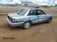 1991 Toyota Camry DLX z VIN 4T1SV21EXMU352321, wystawiony jako Copart lot #62889595 z przebiegiem 171 990 mil mil oraz Czysty tytuł • Clean title. Historia ofert i sprzedaży dostępna na DreamBid. Obrazek 3.