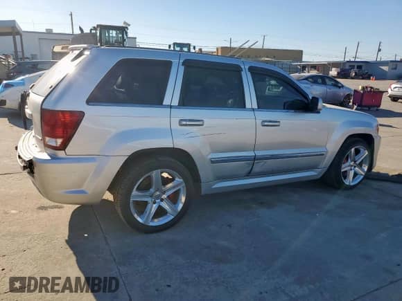 2007 Jeep Grand Cherokee SRT-8 с VIN 1J8HR78397C622839, выставлен на аукционе Copart как лот 50152185 с пробегом 182 655 миль миль и Списание • Salvage title. История ставок и продаж доступна на DreamBid. Изображение 3.