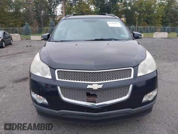 2011 Chevrolet Traverse LTZ z VIN 1GNKVLEDXBJ144490, wystawiony jako IAAI lot #43288275 z przebiegiem Nie podano mil oraz . Historia ofert i sprzedaży dostępna na DreamBid. Obrazek 6.