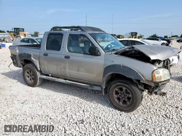 2001 Nissan Frontier XE with VIN 1N6ED27T51C357872, listed as a Copart auction lot 64646255 with 364,415 mi miles and Salvage title. Bid and sale history available at DreamBid. Image 4.