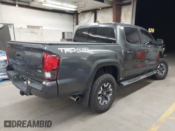 2019 Toyota Tacoma TRD Off Road with VIN 3TMCZ5AN2KM194198, listed as a IAAI auction lot 43463635 with 48,375 mi miles and . Bid and sale history available at DreamBid. Image 4.