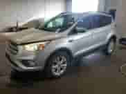2017 Ford Escape SE z VIN 1FMCU9G91HUE87820, wystawiony jako Copart lot #80785325 z przebiegiem 118 426 mil mil oraz Szkoda całkowita • Salvage title. Historia ofert i sprzedaży dostępna na DreamBid. Obrazek 1.