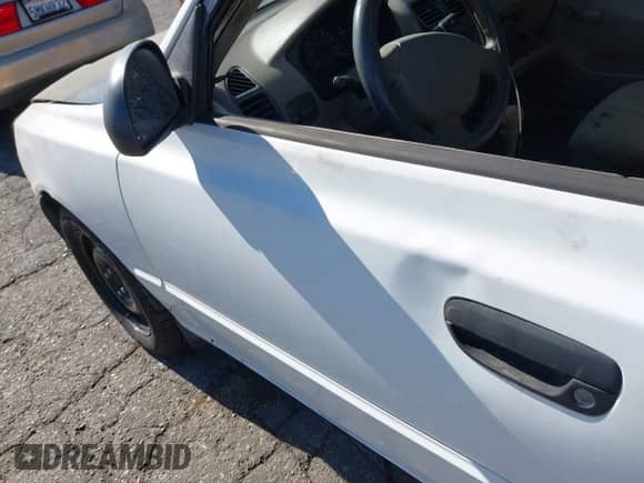 2002 Hyundai Accent GL z VIN KMHCG45C42U375352, wystawiony jako IAAI lot #42699297 z przebiegiem 103 540 mil mil oraz . Historia ofert i sprzedaży dostępna na DreamBid. Obrazek 13.