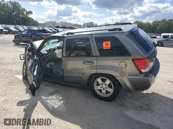 2007 Jeep Grand Cherokee Laredo с VIN 1J8GR48KX7C602147, выставлен на аукционе Copart как лот 86531725 с пробегом Не указан миль и На запчасти • Non repairable. История ставок и продаж доступна на DreamBid. Изображение 2.