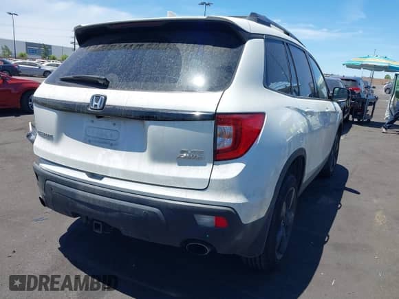 2019 Honda Passport Elite with VIN 5FNYF8H05KB009575, listed as a IAAI auction lot 42804678 with 70,468 mi miles and . Bid and sale history available at DreamBid. Image 4.