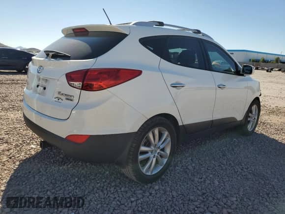 2011 Hyundai Tucson Limited with VIN KM8JU3AC7BU222304, listed as a Copart auction lot 71310104 with 118,726 mi miles and Salvage title. Bid and sale history available at DreamBid. Image 3.