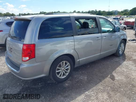 2019 Dodge Grand Caravan SXT with VIN 2C4RDGCG7KR761789, listed as a IAAI auction lot 43333914 with 144,794 mi miles and . Bid and sale history available at DreamBid. Image 4.
