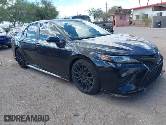 2023 Toyota Camry TRD with VIN 4T1KZ1AK7PU072266, listed as a IAAI auction lot 43208479 with 58,999 mi miles and . Bid and sale history available at DreamBid. Image 1.