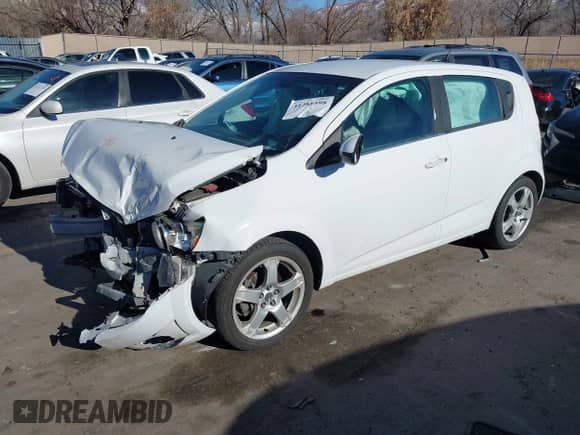 2013 Chevrolet Sonic LTZ with VIN 1G1JE6SH7D4139965, listed as a IAAI auction lot 41288598 with 136,528 mi miles and . Bid and sale history available at DreamBid. Image 2.