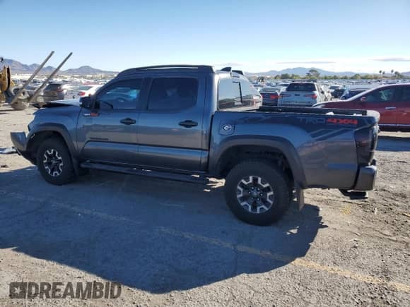 2021 Toyota Tacoma TRD Off Road with VIN 3TMCZ5AN4MM424715, listed as a Copart auction lot 86407685 with 55,946 mi miles and Salvage title. Bid and sale history available at DreamBid. Image 2.