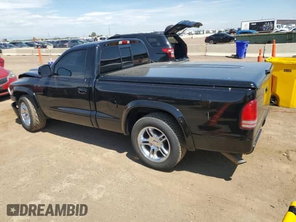 1999 Dodge Dakota SLT with VIN 1B7GL26Z9XS278840, listed as a Copart auction lot 65640885 with 62,454 mi miles and Salvage title. Bid and sale history available at DreamBid. Image 2.