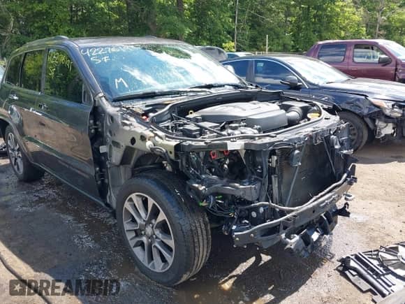 2018 Jeep Grand Cherokee Overland with VIN 1C4RJFCG6JC411466, listed as a IAAI auction lot 42276191 with 95,879 mi miles and . Bid and sale history available at DreamBid. Image 6.