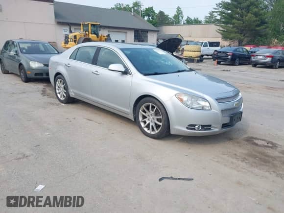 2012 Chevrolet Malibu LTZ z VIN 1G1ZG5E72CF255927, wystawiony jako IAAI lot #42441174 z przebiegiem 134 665 mil mil oraz . Historia ofert i sprzedaży dostępna na DreamBid. Obrazek 1.