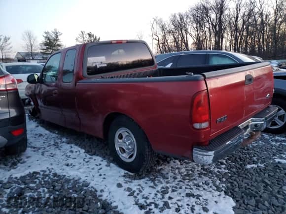 2000 Ford F-150 with VIN 2FTZX1722YCA76324, listed as a Copart auction lot 86598714 with Not provided miles and Salvage title. Bid and sale history available at DreamBid. Image 2.