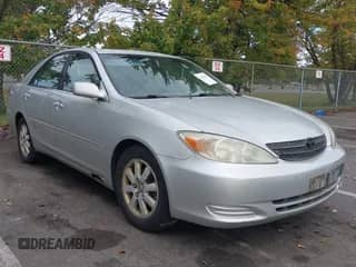 2002 Toyota Camry LE with VIN 4T1BE30K22U601060, listed as a IAAI auction lot 43443949 with 241,972 mi miles and . Bid and sale history available at DreamBid. Image 1.