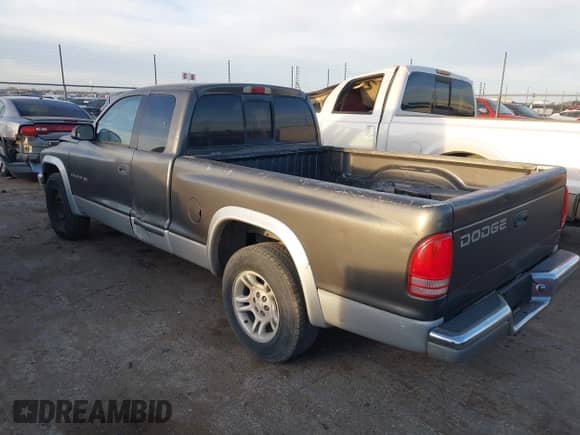 2002 Dodge Dakota SLT with VIN 1B7GL42X42S682184, listed as a IAAI auction lot 41784688 with 168,298 mi miles and . Bid and sale history available at DreamBid. Image 3.