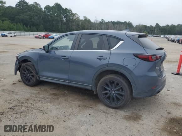 2022 Mazda CX-5 S Carbon Edition z VIN JM3KFBCM2N0612524, wystawiony jako Copart lot #69363155 z przebiegiem 95 306 mil mil oraz Szkoda całkowita • Salvage title. Historia ofert i sprzedaży dostępna na DreamBid. Obrazek 2.