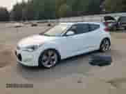 2014 Hyundai Veloster z VIN KMHTC6ADXEU187204, wystawiony jako Copart lot #71670725 z przebiegiem 94 917 mil mil oraz Czysty tytuł • Clean title. Historia ofert i sprzedaży dostępna na DreamBid. Obrazek 1.