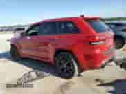 2014 Jeep Grand Cherokee SRT-8 z VIN 1C4RJFDJ6EC331312, wystawiony jako Copart lot #59111145 z przebiegiem 112 803 mil mil oraz Szkoda całkowita • Salvage title. Historia ofert i sprzedaży dostępna na DreamBid. Obrazek 2.