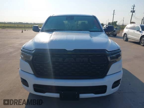 2025 Ram 1500 Tradesman with VIN 1C6RREGGXSN634409, listed as a IAAI auction lot 42945287 with 5,990 mi miles and . Bid and sale history available at DreamBid. Image 12.