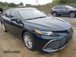 2021 Toyota Camry LE with VIN 4T1C11AK8MU548158, listed as a IAAI auction lot 43333222 with 34,824 mi miles and . Bid and sale history available at DreamBid. Image 1.