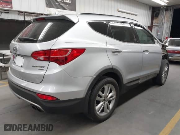 2013 Hyundai Santa Fe Sport z VIN 5XYZUDLA7DG095597, wystawiony jako IAAI lot #42931769 z przebiegiem 105 858 mil mil oraz . Historia ofert i sprzedaży dostępna na DreamBid. Obrazek 4.