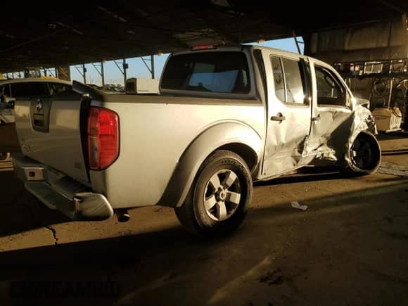 2009 Nissan Frontier SE with VIN 1N6AD07U49C405644, listed as a Copart auction lot 44342525 with 212,826 mi miles and Salvage title. Bid and sale history available at DreamBid. Image 3.