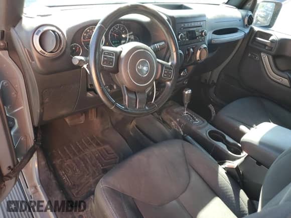 2015 Jeep Wrangler Sport with VIN 1C4AJWAG7FL613059, listed as a Copart auction lot 69094475 with 105,891 mi miles and Salvage title. Bid and sale history available at DreamBid. Image 8.