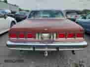 1984 Chevrolet Caprice z VIN 1G1AN69H0EH138172, wystawiony jako Copart lot #72030645 z przebiegiem Nie podano mil oraz Szkoda całkowita • Salvage title. Historia ofert i sprzedaży dostępna na DreamBid. Obrazek 6.