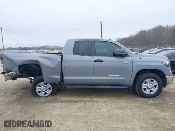 2019 Toyota Tundra SR z VIN 5TFRY5F14KX245486, wystawiony jako IAAI lot #41171640 z przebiegiem 85 697 mil mil oraz . Historia ofert i sprzedaży dostępna na DreamBid. Obrazek 13.