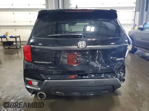 2023 Honda Passport EX-L with VIN 5FNYF8H54PB022207, listed as a Copart auction lot 64393685 with 59,327 mi miles and Salvage title. Bid and sale history available at DreamBid. Image 6.