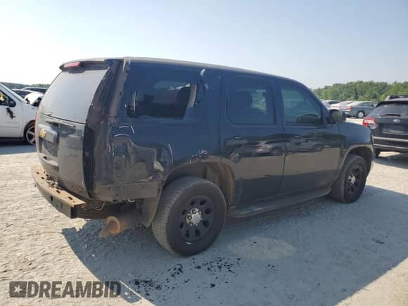 2014 Chevrolet Tahoe Commercial with VIN 1GNLC2E07ER207777, listed as a Copart auction lot 62143385 with Not provided miles and Salvage title. Bid and sale history available at DreamBid. Image 3.