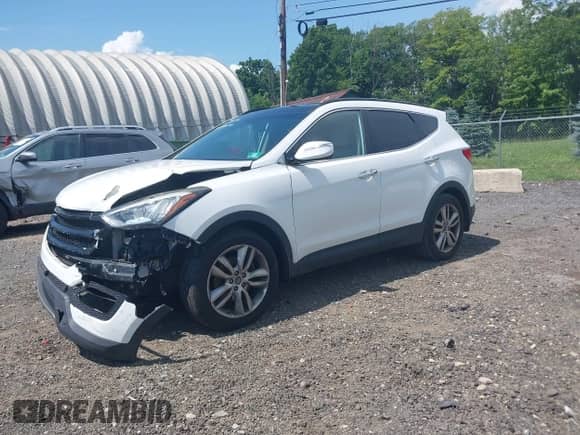 2014 Hyundai Santa Fe with VIN 5XYZWDLA1EG225384, listed as a IAAI auction lot 42518990 with 99,125 mi miles and . Bid and sale history available at DreamBid. Image 2.