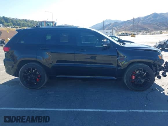 2016 Jeep Grand Cherokee SRT with VIN 1C4RJFDJ3GC404557, listed as a IAAI auction lot 43124966 with 112,863 mi miles and . Bid and sale history available at DreamBid. Image 14.