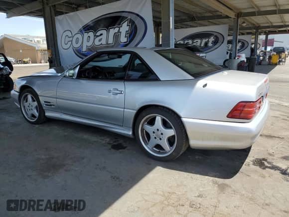 2000 Mercedes-Benz SL 500 with VIN WDBFA68F1YF192409, listed as a Copart auction lot 57182425 with 205,370 mi miles and Salvage title. Bid and sale history available at DreamBid. Image 2.