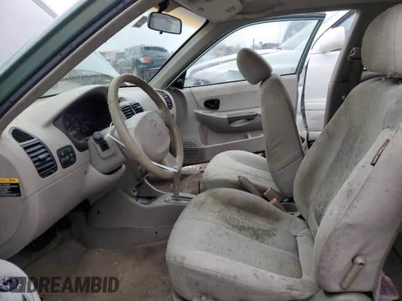 2003 Hyundai Accent GL с VIN KMHCG35C23U264701, выставлен на аукционе Copart как лот 80029154 с пробегом 142 090 миль миль и Списание • Salvage title. История ставок и продаж доступна на DreamBid. Изображение 7.