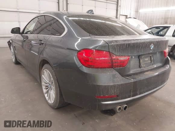 2015 BMW 4 Series 428i xDrive with VIN WBA4A7C52FD414734, listed as a IAAI auction lot 42377682 with 129,264 mi miles and . Bid and sale history available at DreamBid. Image 3.