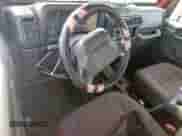 2000 Jeep Wrangler SE with VIN 1J4FA29P6YP703375, listed as a Copart auction lot 66914735 with 174,624 mi miles and Salvage title. Bid and sale history available at DreamBid. Image 8.