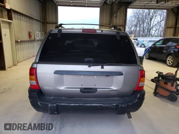1999 Jeep Grand Cherokee Laredo с VIN 1J4G258S1XC668517, выставлен на аукционе Copart как лот 79958454 с пробегом Не указан миль и Списание • Salvage title. История ставок и продаж доступна на DreamBid. Изображение 6.