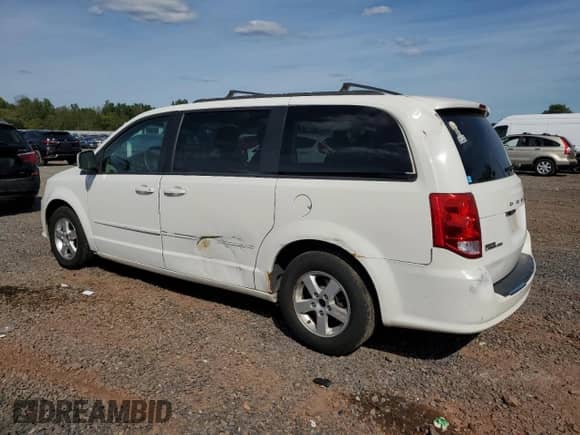 2012 Dodge Grand Caravan SXT with VIN 2C4RDGCG4CR404409, listed as a Copart auction lot 84071695 with 217,917 mi miles and Salvage title. Bid and sale history available at DreamBid. Image 2.