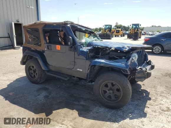 2003 Jeep Wrangler X z VIN 1J4FA39S43P357281, wystawiony jako Copart lot #67979335 z przebiegiem Nie podano mil oraz Szkoda całkowita • Salvage title. Historia ofert i sprzedaży dostępna na DreamBid. Obrazek 4.