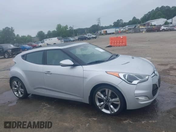 2012 Hyundai Veloster w/Black Int с VIN KMHTC6AD1CU034787, выставлен на аукционе IAAI как лот 42607847 с пробегом 126 912 миль миль и . История ставок и продаж доступна на DreamBid. Изображение 14.
