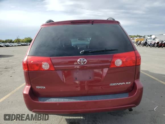 2010 Toyota Sienna XLE с VIN 5TDYK4CC1AS342159, выставлен на аукционе Copart как лот 84412115 с пробегом 214 042 миль миль и Списание • Salvage title. История ставок и продаж доступна на DreamBid. Изображение 6.