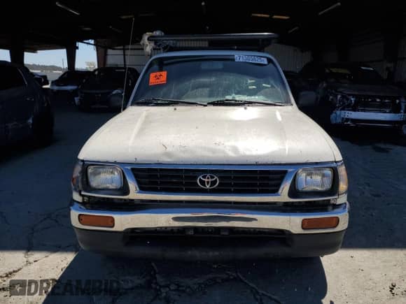 1995 Toyota Tacoma z VIN 4TAUN53B5SZ002480, wystawiony jako Copart lot #71305825 z przebiegiem 467 592 mil mil oraz Szkoda całkowita • Salvage title. Historia ofert i sprzedaży dostępna na DreamBid. Obrazek 5.