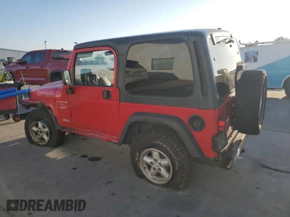 2000 Jeep Wrangler Sport z VIN 1J4FA49SXYP768858, wystawiony jako Copart lot #72104145 z przebiegiem 228 361 mil mil oraz Szkoda całkowita • Salvage title. Historia ofert i sprzedaży dostępna na DreamBid. Obrazek 2.