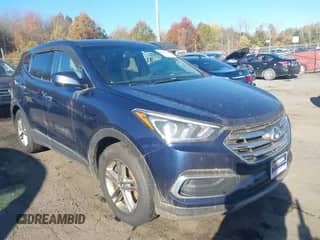 2018 Hyundai Santa Fe 2.4L z VIN 5XYZTDLB1JG569356, wystawiony jako IAAI lot #43552900 z przebiegiem 203 509 mil mil oraz . Historia ofert i sprzedaży dostępna na DreamBid. Obrazek 1.