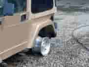 1999 Jeep Wrangler Sahara with VIN 1J4FY49S3XP407594, listed as a IAAI auction lot 42369363 with 253,780 mi miles and . Bid and sale history available at DreamBid. Image 12.