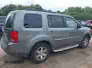 2009 Honda Pilot Touring with VIN 5FNYF48969B031280, listed as a IAAI auction lot 42934690 with 163,844 mi miles and . Bid and sale history available at DreamBid. Image 4.